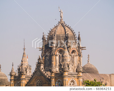 Mumbai, India - December 17, 2018: Chhatrapati Shivaji Terminus railway station (CSTM), is a historic railway station and a UNESCO World Heritage Site in Mumbai, Maharashtra, India 66964253