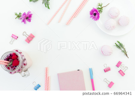 Berries smoothie with straws, marshmallow, diary, pen and pink flowers on white. Flat lay. 66964341
