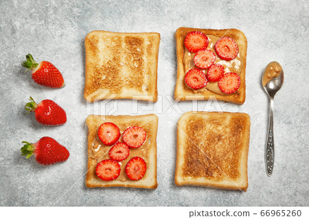 toast with peanut butter and strawberries toast with peanut butter and strawberries 66965260