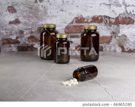Home therapy. Four different bottles of different pills. Home therapy. Four different bottles of different pills. 66965290