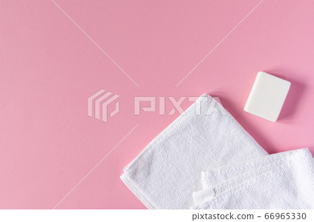 Towel with soap on a pink background Towel with soap on a pink background 66965330