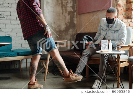 Greeting each other with foot gesture Greeting each other with foot gesture 66965846