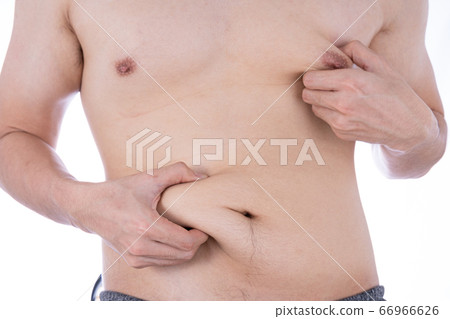 Close up the excessive fat belly on isolated white Close up the excessive fat belly on isolated white 66966626