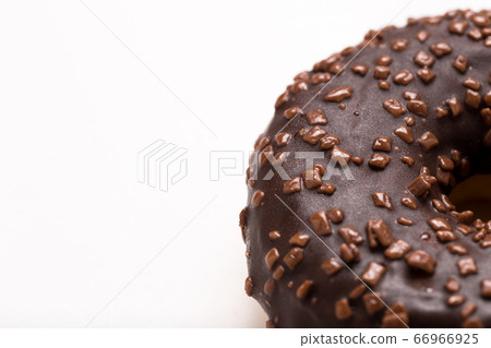 Chocolate donut on a white background close-up. Chocolate donut on a white background close-up. 66966925