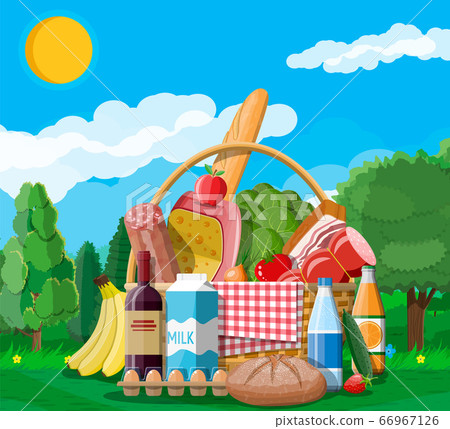 WIcker picnic basket full of products. 66967126