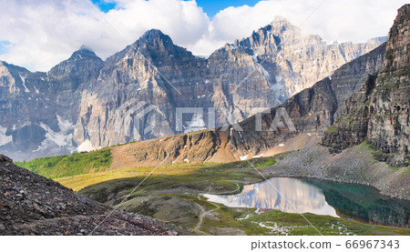 Beautiful mountain panorama of Rocky Mountains in Banff National Park at sunset, Alberta, Canada Beautiful mountain panorama of Rocky Mountains in Banff National Park at sunset, Alberta, Canada 66967343