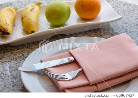 Tropical fruit served on the table. Orange, banana Tropical fruit served on the table. Orange, banana 66967424