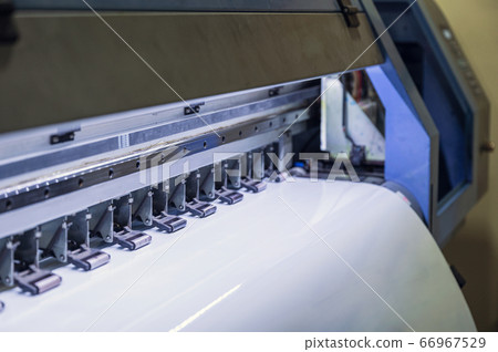 Large inkjet printer printing on vinyl paper Large inkjet printer printing on vinyl paper 66967529