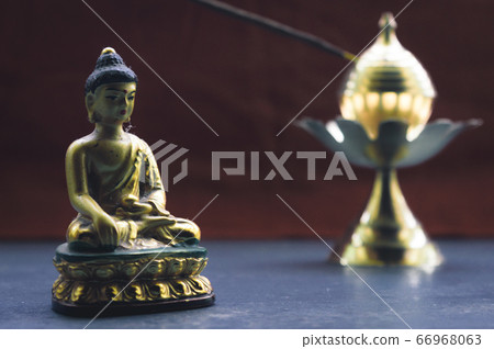 Close up Still Life of antique Meditating Buddha 66968063