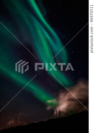 Green Aurora Borealis Northern lights shining with Green Aurora Borealis Northern lights shining with 66970511