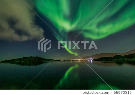 Green Northern lights reflecting in the lake with Green Northern lights reflecting in the lake with 66970515