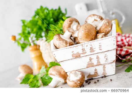 Raw mushrooms champignons on white background, 66970964