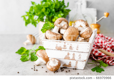 Raw mushrooms champignons on white background, 66970966