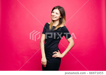 Woman in black dress lauthing emotionaly posing Woman in black dress lauthing emotionaly posing 66971055