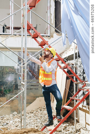 Contractor at constuction site Contractor at constuction site 66975208
