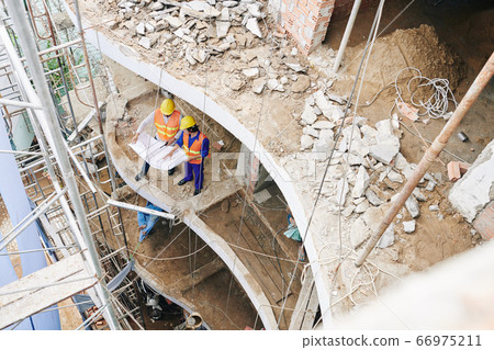 Workers building hotel Workers building hotel 66975211