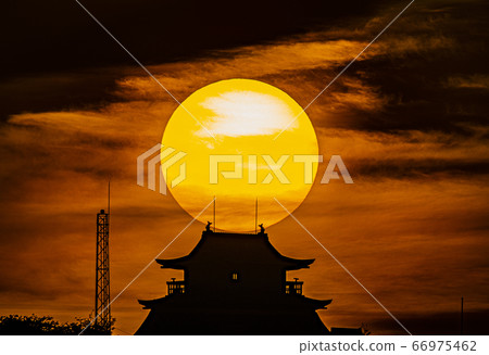 The sun rising directly above the castle tower Kirin Castle 66975462