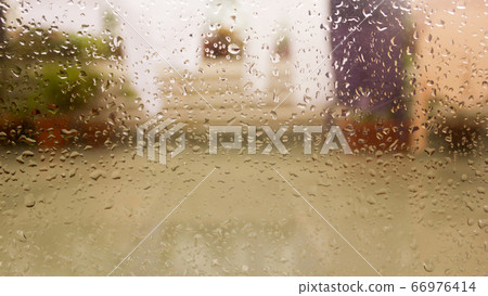 Rain Drops On Surface of wet Window Glass pane Rain Drops On Surface of wet Window Glass pane 66976414