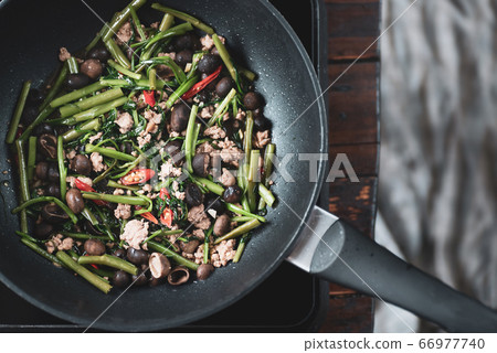 Northern Thai food, Stir fried morning glory with minced pork and Thai puff ball mushroom Northern Thai food, Stir fried morning glory with minced pork and Thai puff ball mushroom 66977740