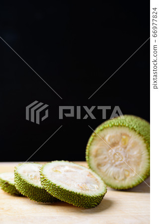 Sliced young jackfruit on wooden table, food ingredient 66977824