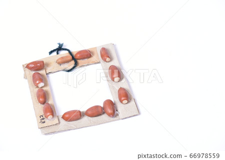 Handmade frame made of acorn and cardboard 66978559