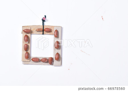 Handmade frame made of acorn and cardboard 66978560