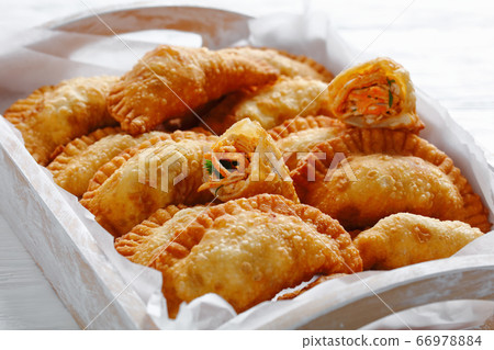 close-up of deep fried Buffalo Chicken Empanadas 66978884