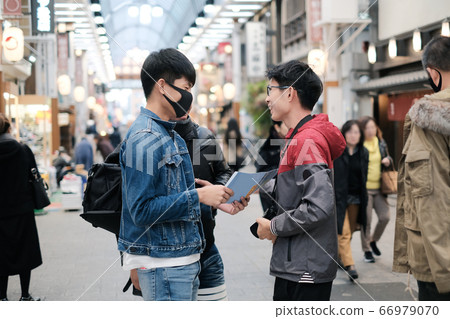 Group of young asian friends stop talking about the trip for travel on walking street 66979070