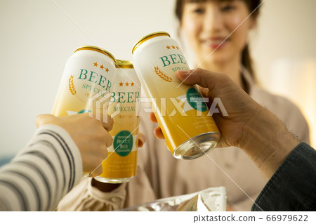 Home drinking canned beer toast 66979622