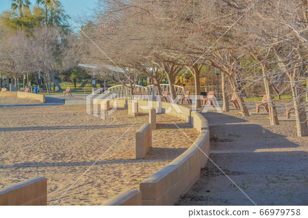 A walkway and beach along the Colorado River at the Rotary Community Park in Lake Havasu City, Arizona USA 66979758