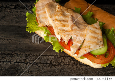 cheeseburger on a wooden surface cheeseburger on a wooden surface 66981136