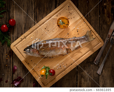 dish on a wooden surface dish on a wooden surface 66981895