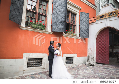 Beautiful couple walking on the European city Beautiful couple walking on the European city 66984057