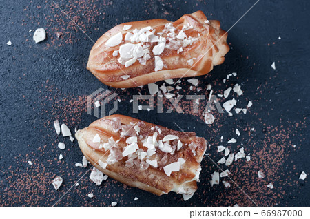 Tasty eclairs on table 66987000