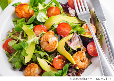 Avocado shrimp salad with cherry tomatoes and 66987127