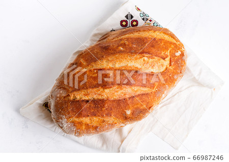 Freshy baked homemade bread on a light grey marble 66987246