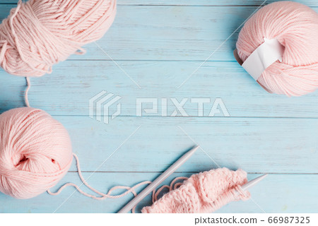 Top view of winding wools and knitting pattern on Top view of winding wools and knitting pattern on 66987325
