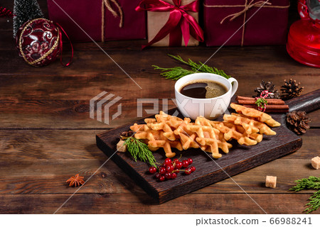 Beautiful delicious Belgian waffles on a Christmas Beautiful delicious Belgian waffles on a Christmas 66988241