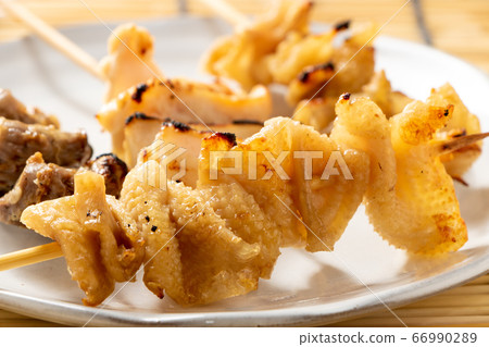 An assortment of chicken skewers with a yakitori (salted) platter. 66990289