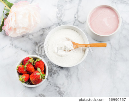 Collagen protein powder in bowl on marble 66990567