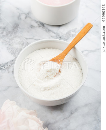 Collagen protein powder in bowl on marble 66990568
