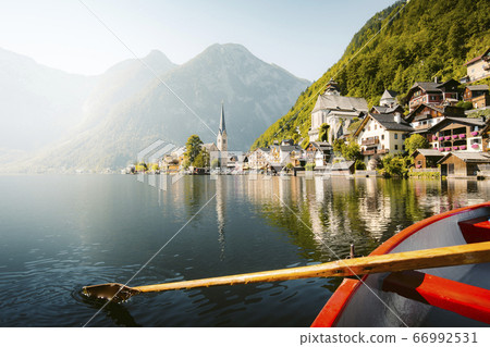 Classic view of Hallstatt with traditional rowing boat in summer, Austria 66992531