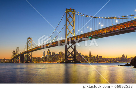 San Francisco skyline with Oakland Bay Bridge at twilight, California, USA San Francisco skyline with Oakland Bay Bridge at twilight, California, USA 66992532