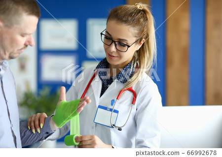 Man with bruised arm 66992678