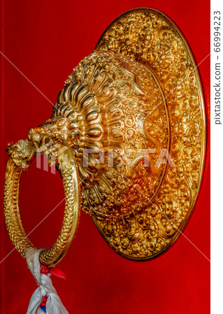 Lion shaped door handle in Buddhist temple 66994223