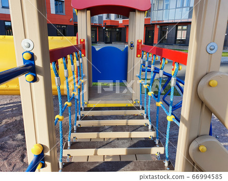 Walk bridge rope. Fastening elements of structures on the bright playground. 66994585