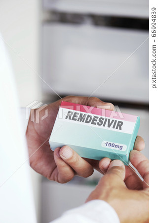 man with a simulated box of remdesivir 66994839
