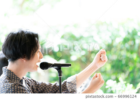 Vocalist singing at an outdoor festival Vocalist singing at an outdoor festival 66996124