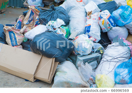 pile of waste in a container. garbage collapse. Janitors ' strike. environmental disaster of plastic recycling pile of waste in a container. garbage collapse. Janitors ' strike. environmental disaster of plastic recycling 66996569