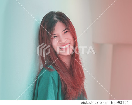 Happy Asian woman portrait with orange hair and Happy Asian woman portrait with orange hair and 66998105
